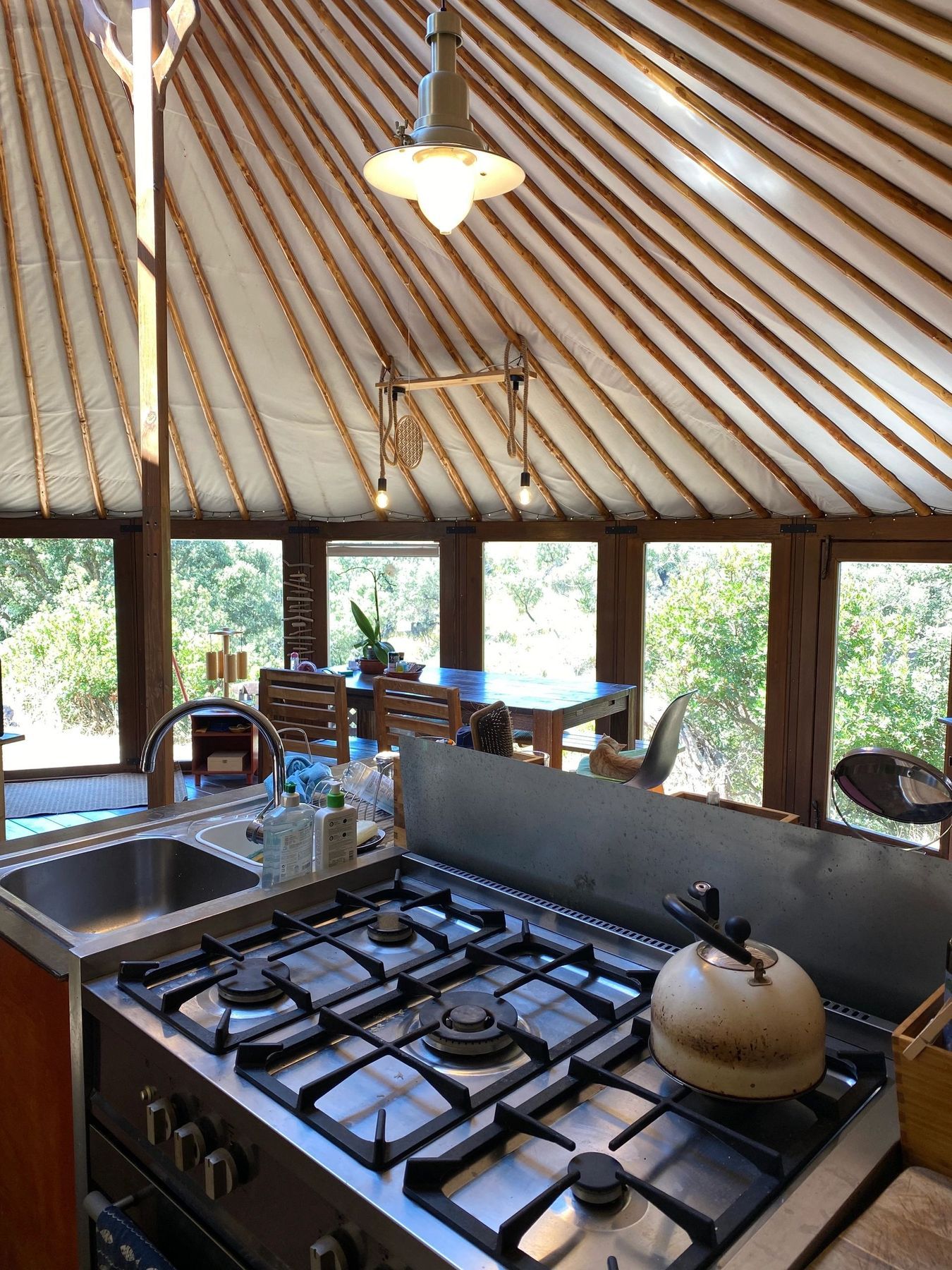 The connected glass wall yurt residence